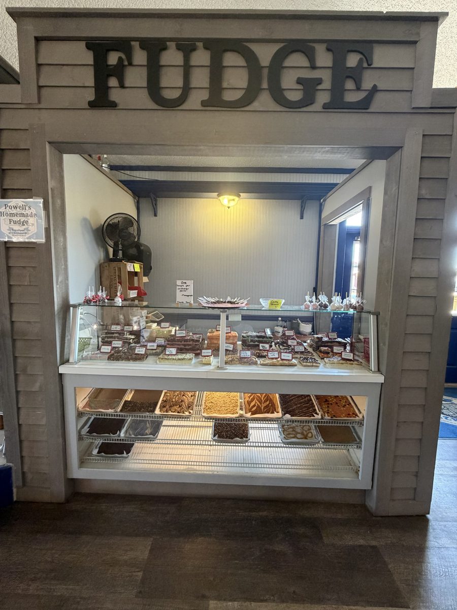 The Fudge counter at Blue 42's Brewing Barn with Powell's Homemade Fudge sign and glass display case
