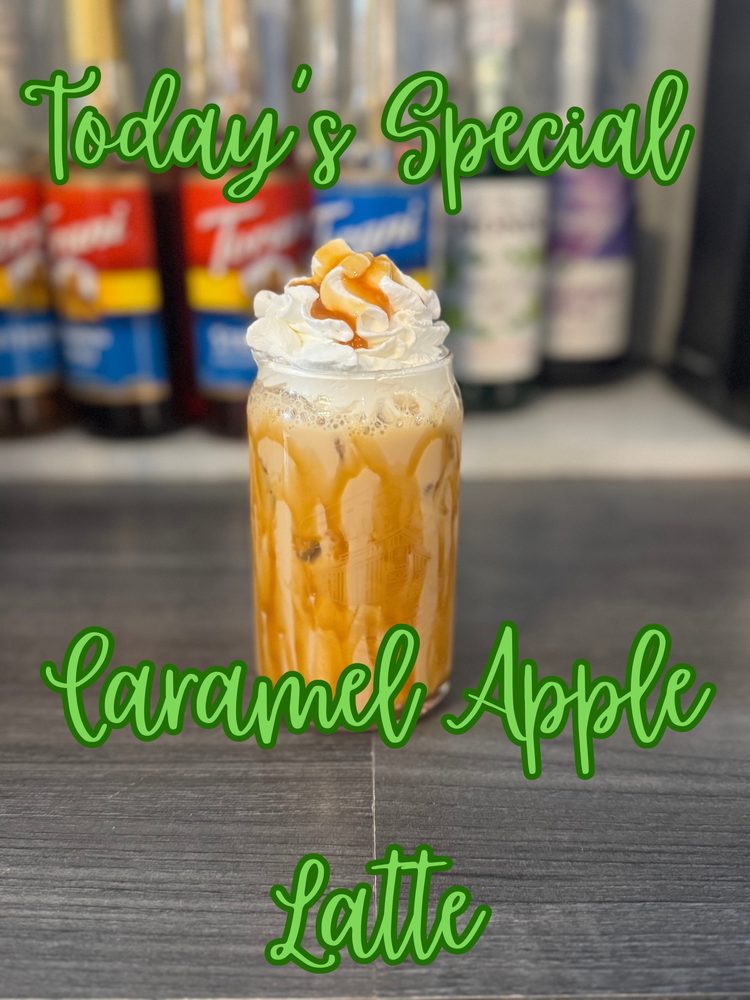 Iced Caramel Apple Latte topped with whipped cream and caramel drizzle at Blue 42's Brewing Barn